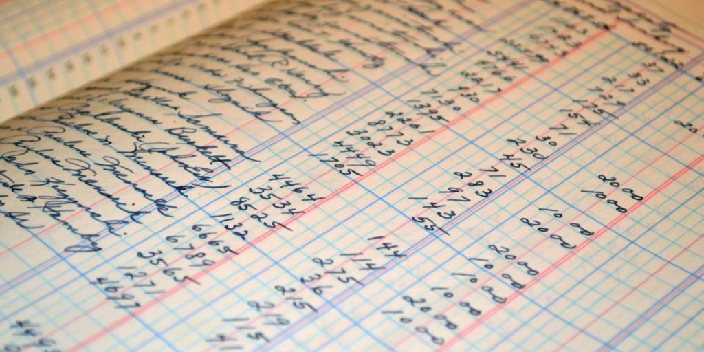 Close-up of a vintage handwritten ledger detailing financial records and accounts.